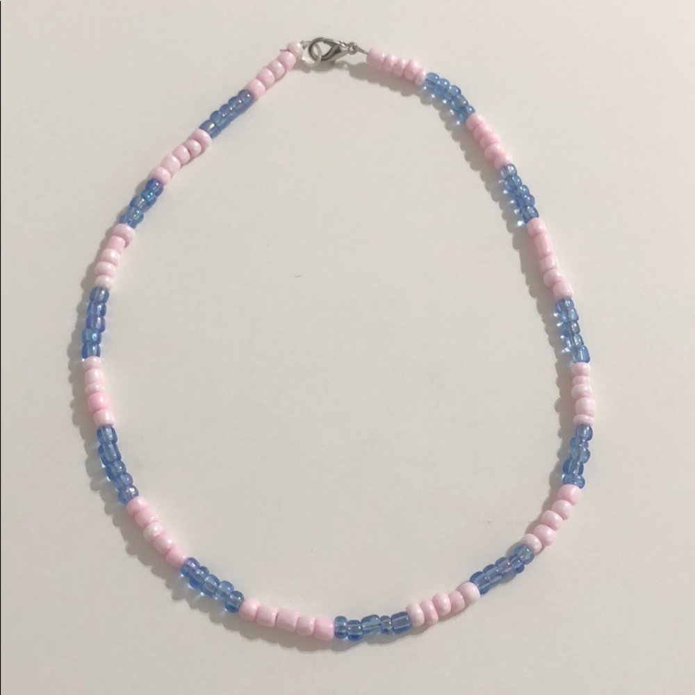 Light pink and iridescent blue beaded necklace